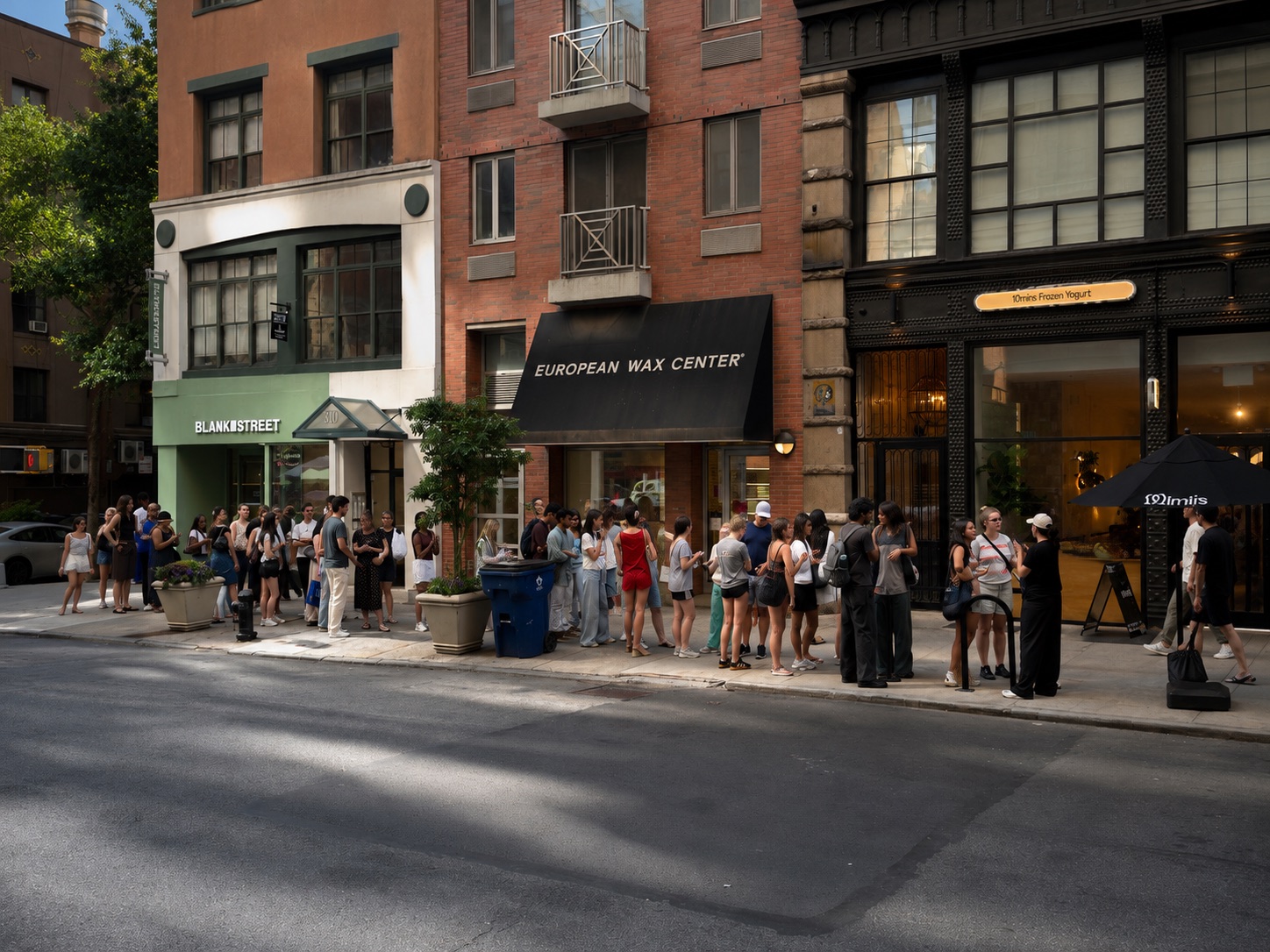 A real line of people waiting on a New York sidewalk outside Blank Street coffee